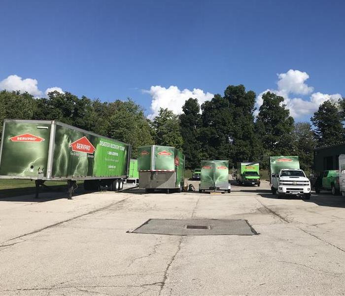 Fleet of green SERVPRO trucks in Summit County