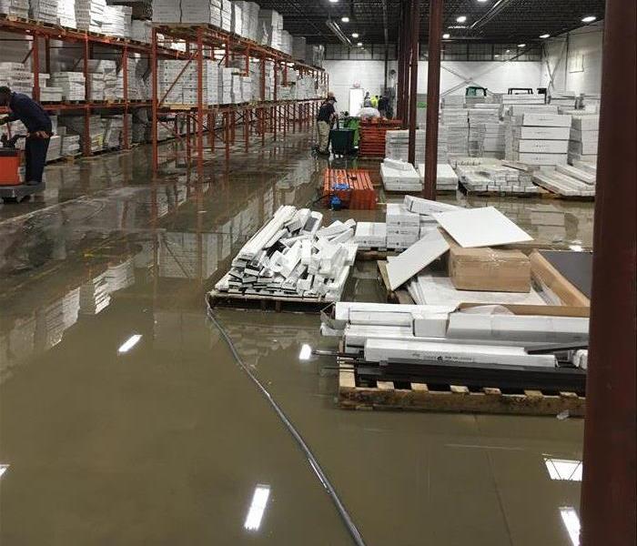 Water covering warehouse floor in SE Summit County