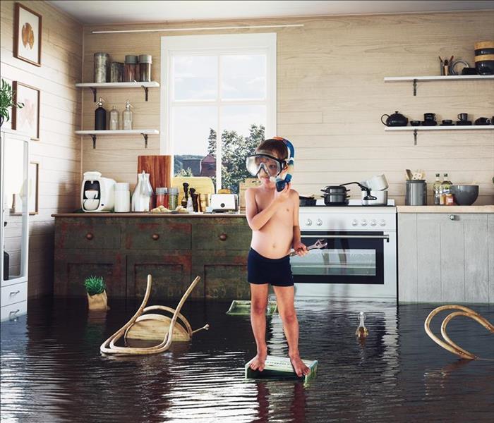 Kid in flooded kitchen
