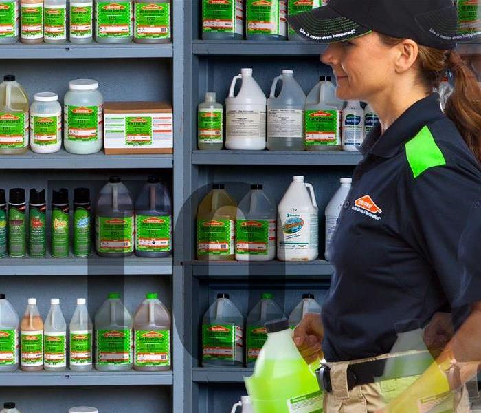 SERVPRO Person in front of a shelf. 